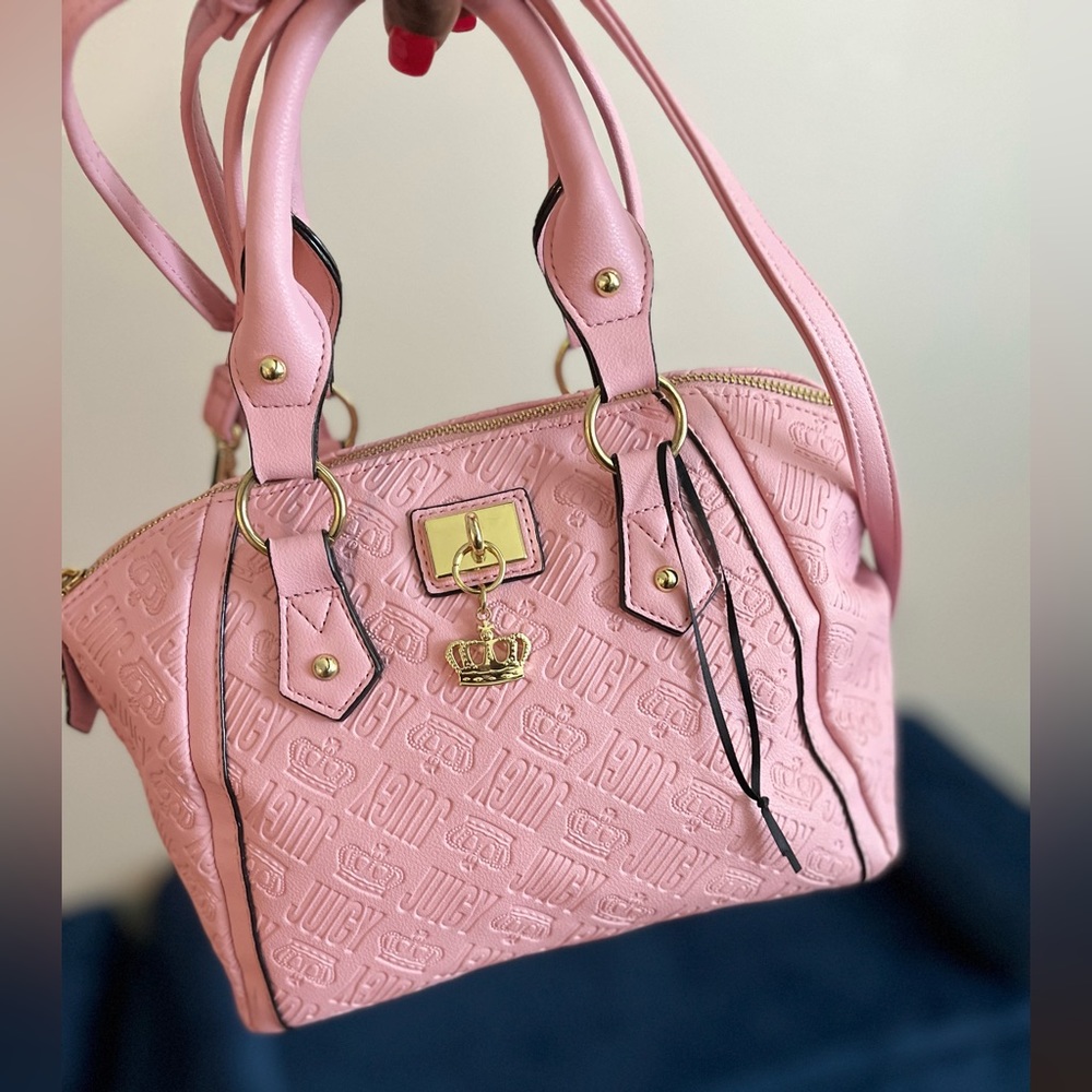 Light pink purse, comes with a strap to wear as a cross body.